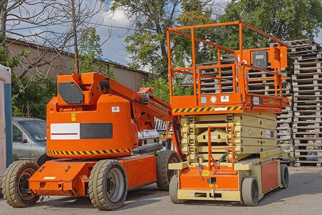 forklift driver organizing inventory in warehouse in Belding, MI